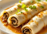 Рулеты грибные в луковом соусе